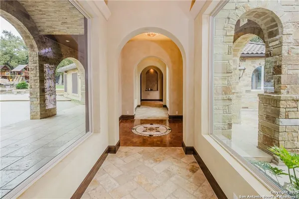 a lobby with furniture and a fireplace