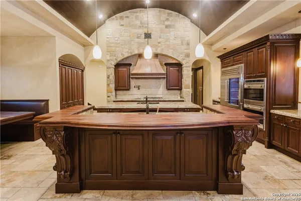 a bathroom with a sink a vanity and a mirror
