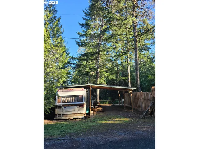 a view of a bench in a backyard
