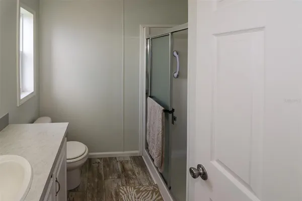 a en suite bathroom with a sink and mirror