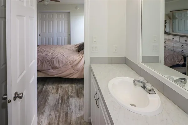 a bedroom with a bed and a dresser