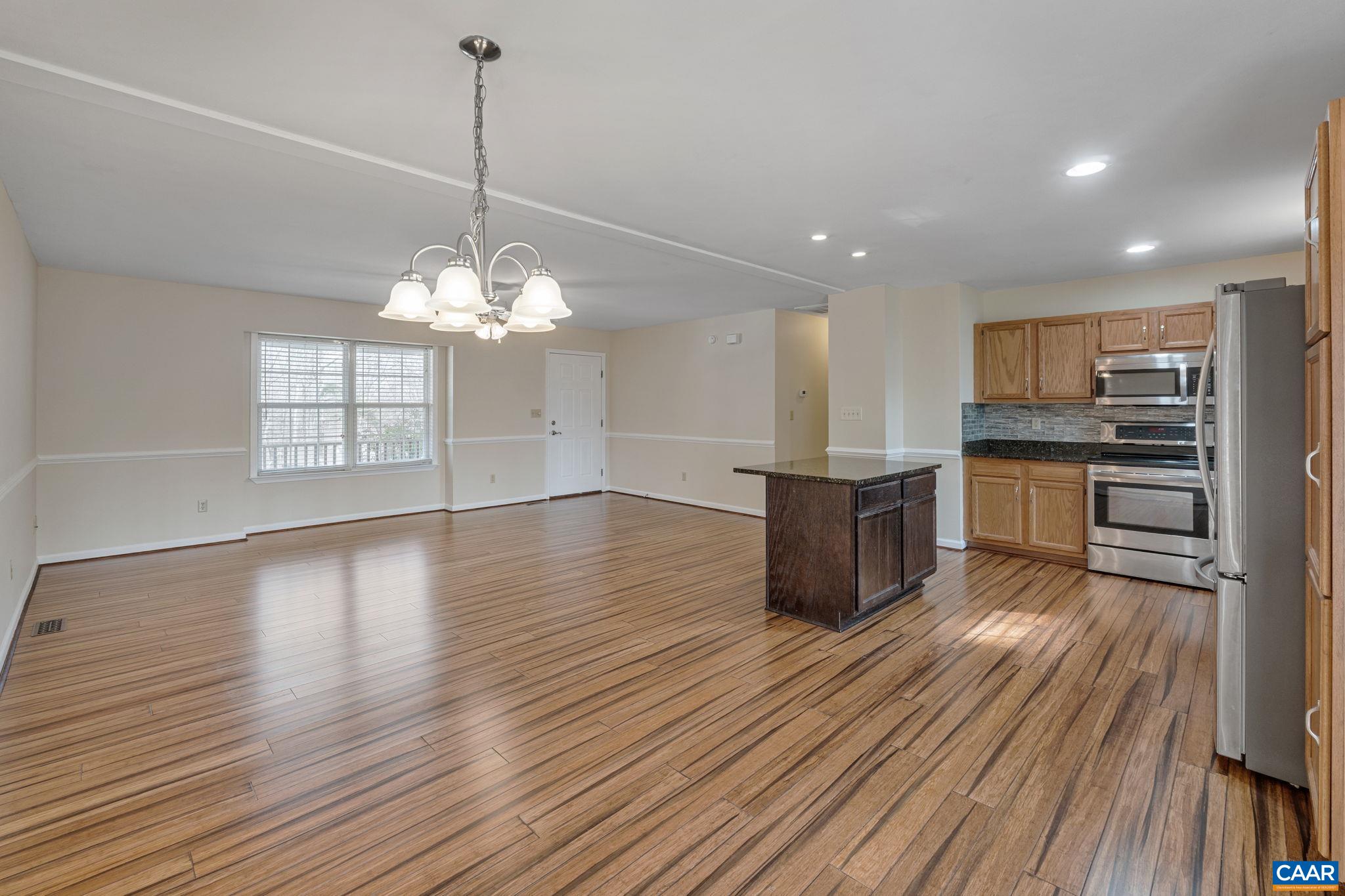 7 Riverside Drive Palmyra, VA 22963 - Photo 12 of 26 a kitchen with stainless steel appliances granite countertop a refrigerator a stove and a wooden floors