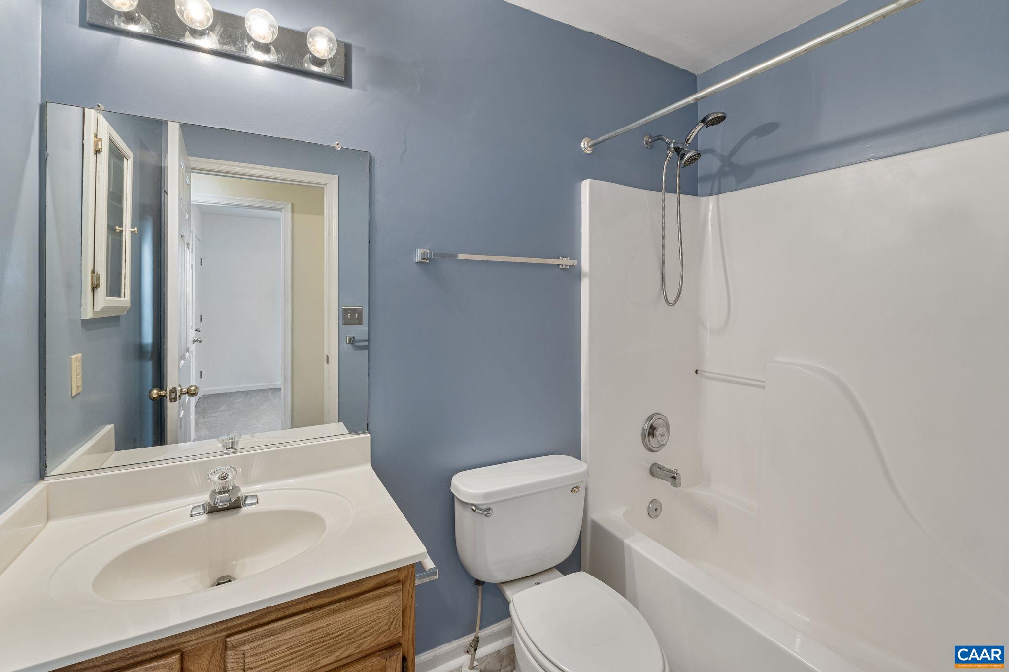 7 Riverside Drive Palmyra, VA 22963 - Photo 14 of 26 a bathroom with a sink toilet and shower