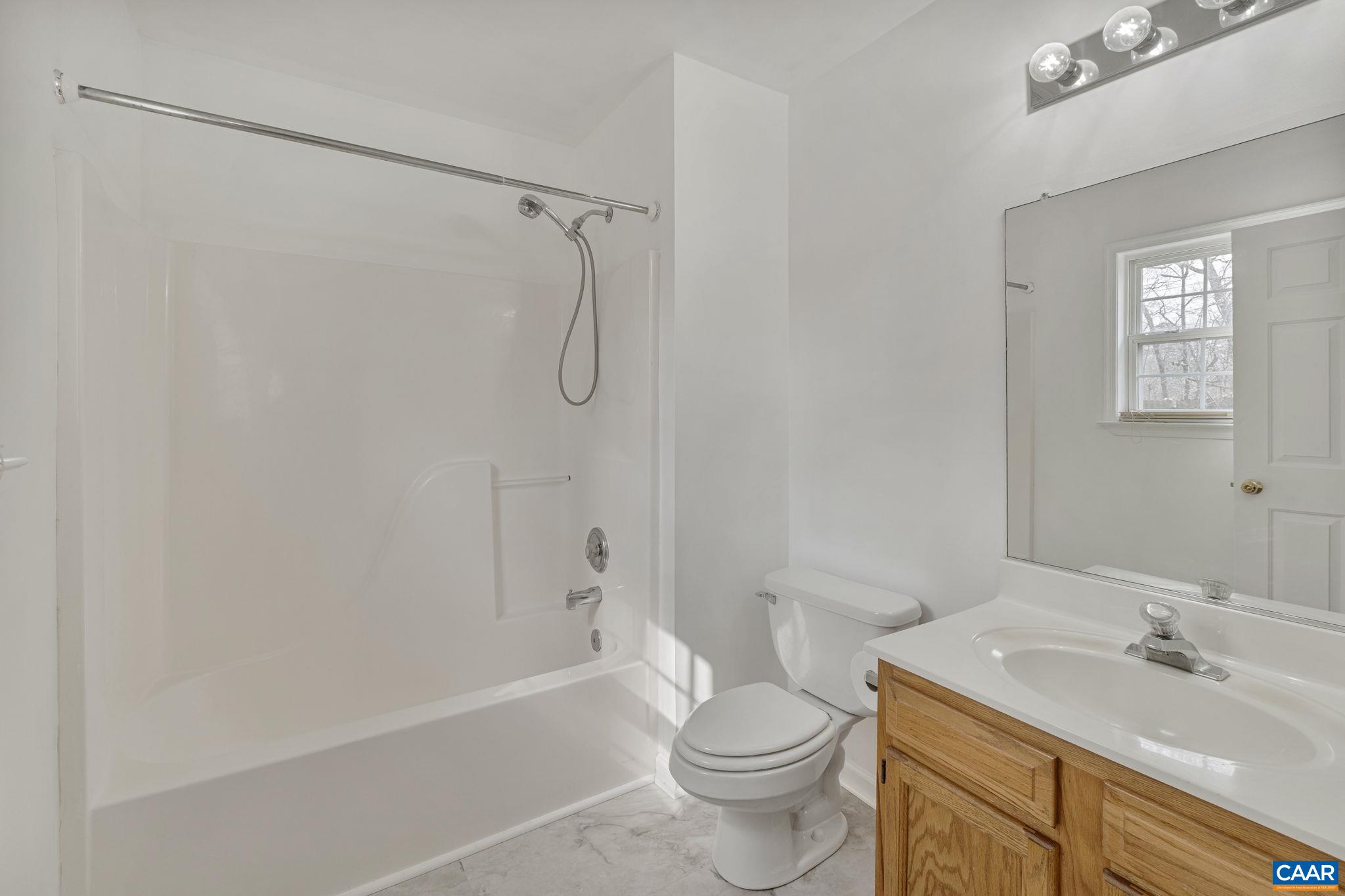 7 Riverside Drive Palmyra, VA 22963 - Photo 17 of 26 a bathroom with a sink toilet and shower