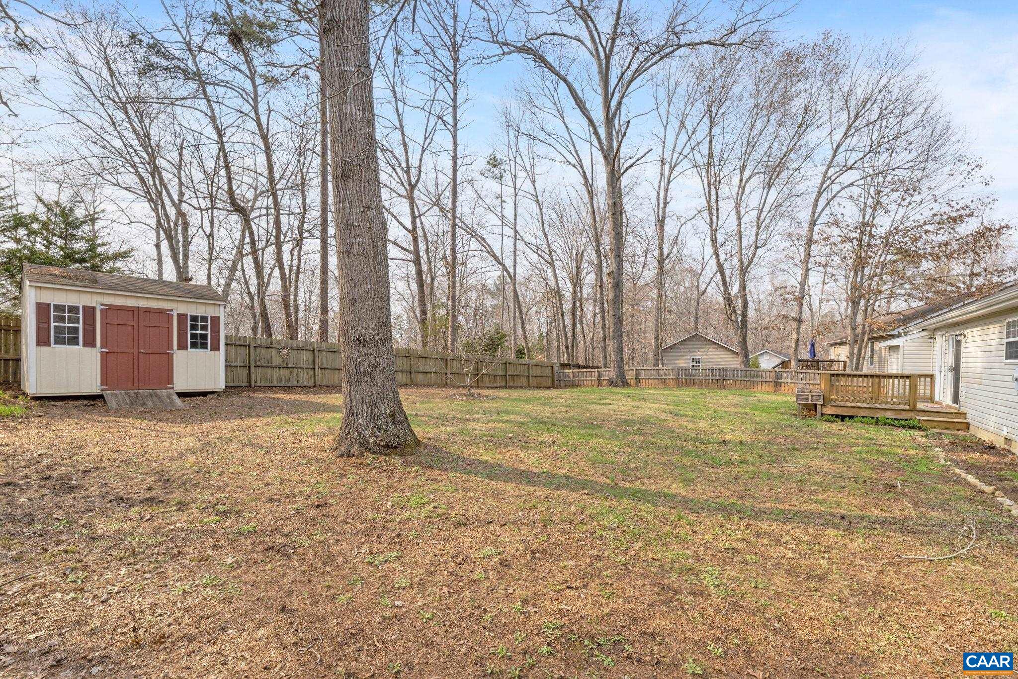 7 Riverside Drive Palmyra, VA 22963 - Photo 24 of 26 a house with trees in front of it