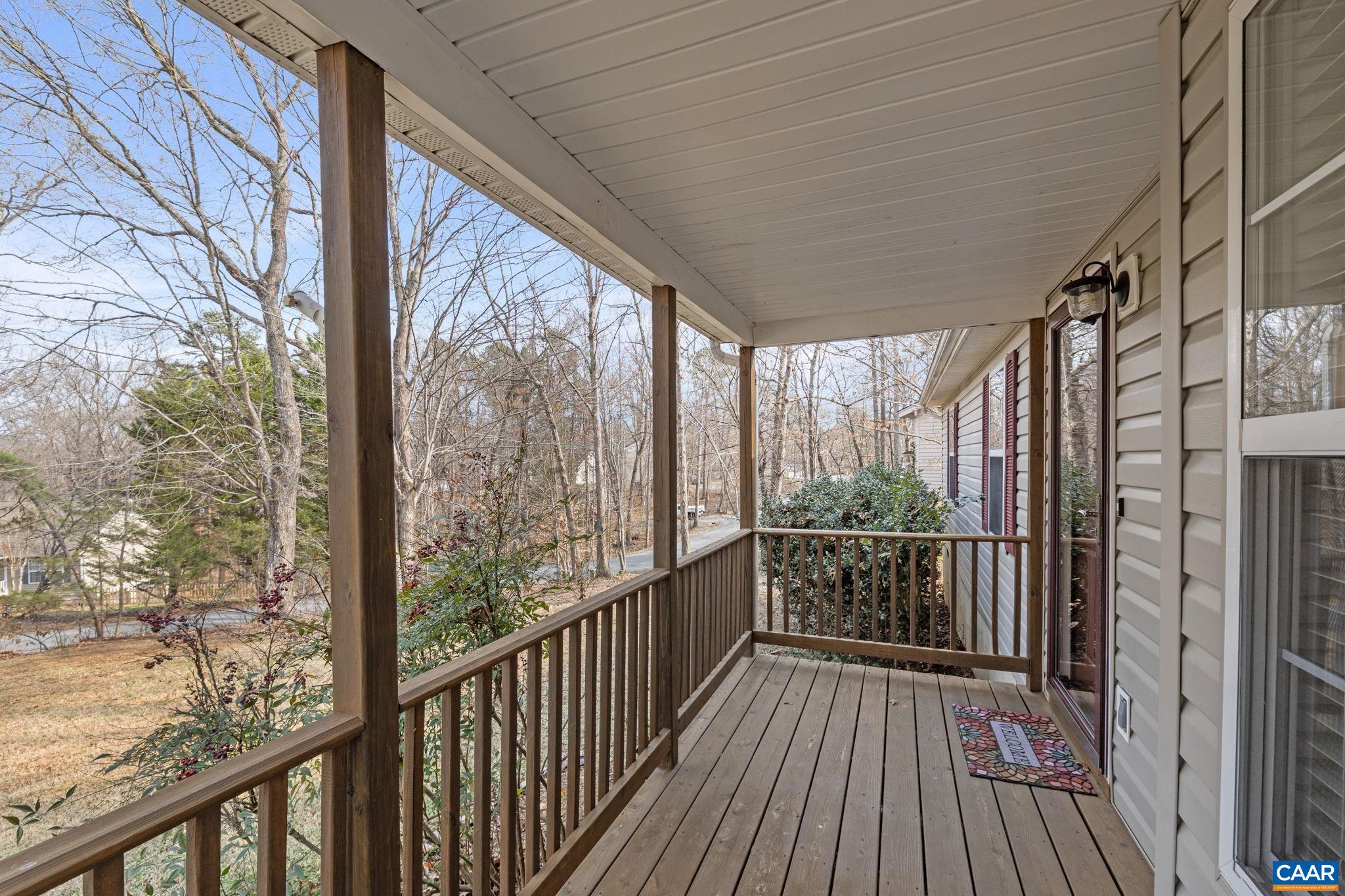 7 Riverside Drive Palmyra, VA 22963 - Photo 4 of 26 a view of a balcony with wooden floor