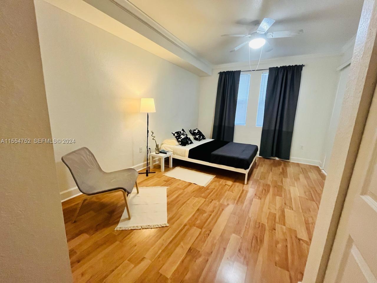 1121 Renaissance Way, Unit 1121 Boynton Beach, FL 33426 - Photo 15 of 26 a room with a bed and furniture