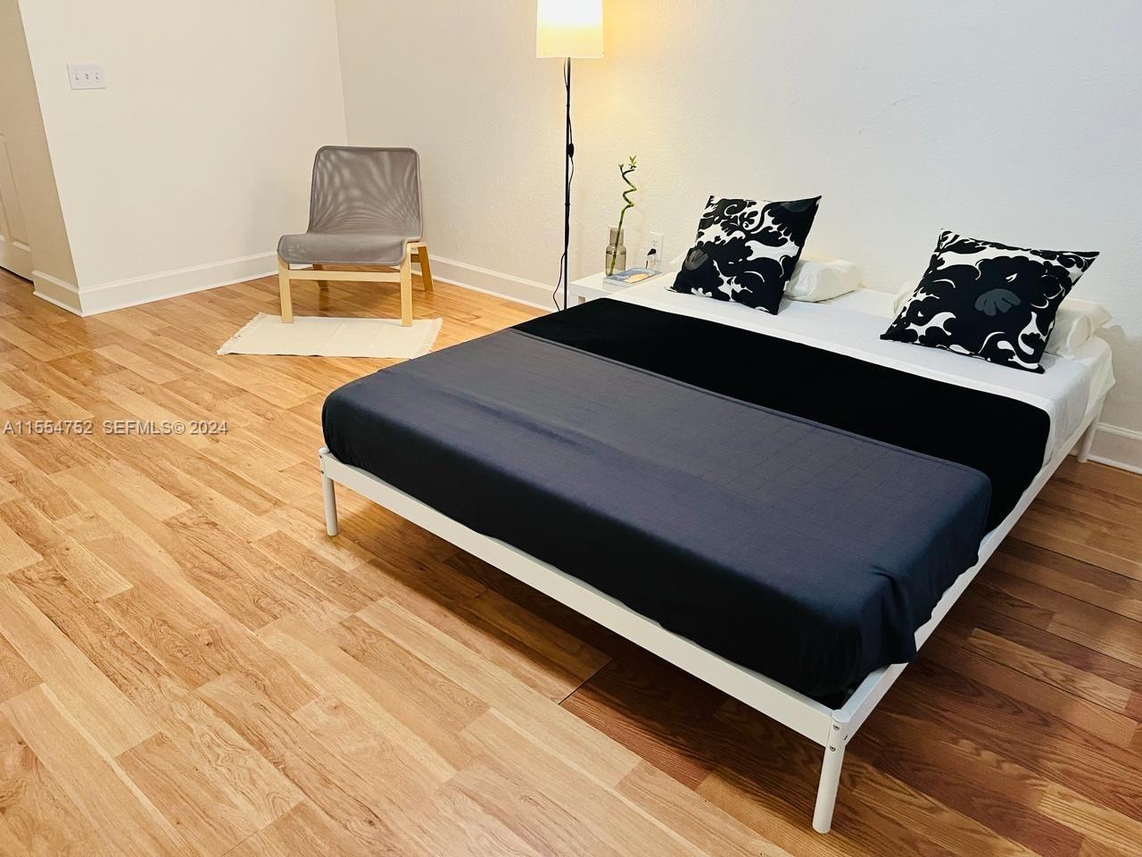 1121 Renaissance Way, Unit 1121 Boynton Beach, FL 33426 - Photo 18 of 26 a living room with chairs