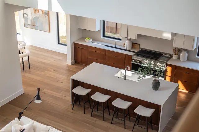 a dining room with furniture and wooden floor