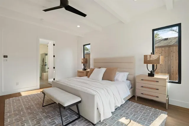 a bedroom with a bed and a table