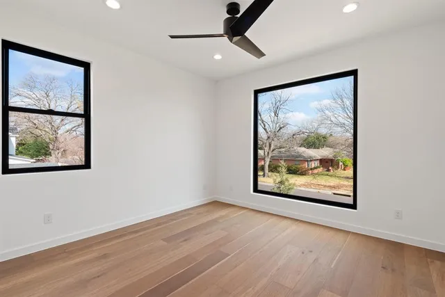 a view of an empty room with a painting on the wall
