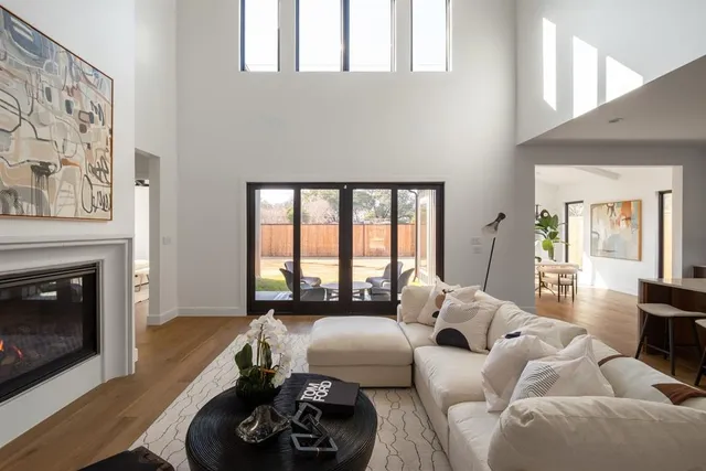 a living room with furniture window and a fireplace