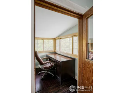 a balcony with hardwood wall and sink