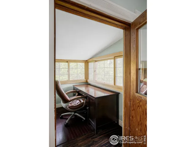 a balcony with hardwood wall and sink
