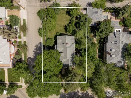a view of a city with mountains in the background