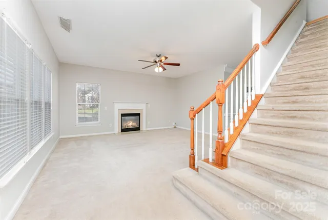a view of entryway and hall with a chandelier
