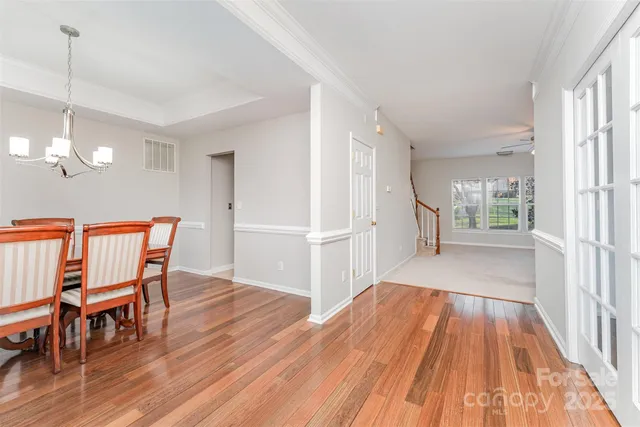 a view of a room with wooden floor and staircase
