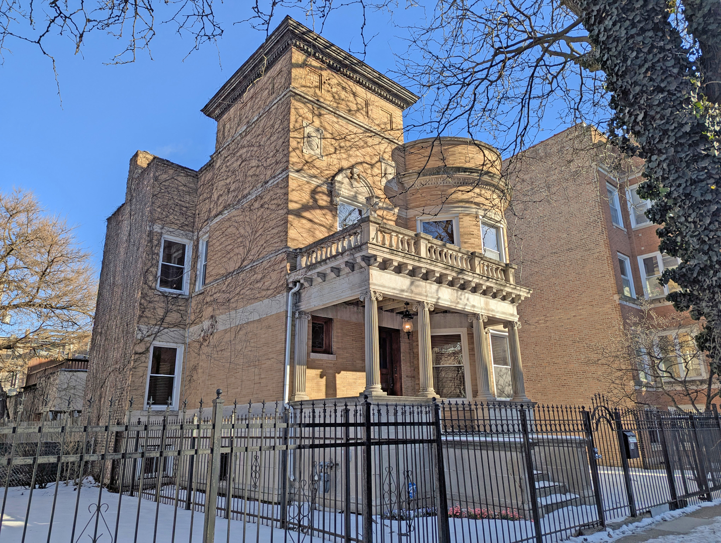 836 East 52nd Street Chicago, IL 60615 - Photo 2 of 43 a view of a white building among the street side