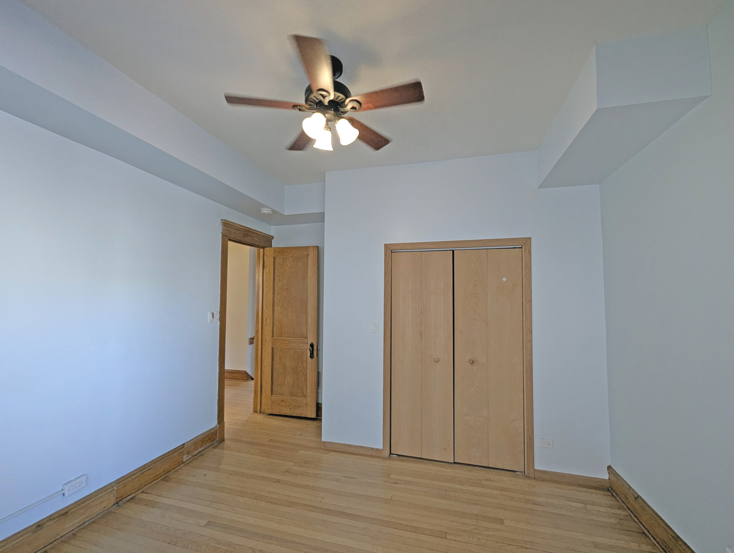 836 East 52nd Street Chicago, IL 60615 - Photo 30 of 43 a view of an empty room with wooden floor