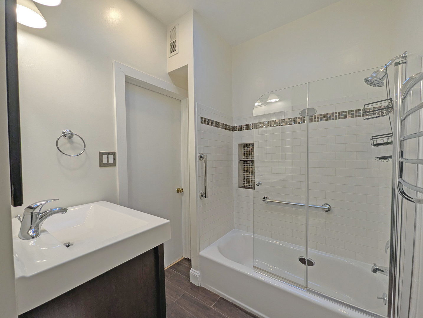 836 East 52nd Street Chicago, IL 60615 - Photo 33 of 43 a bathroom with a tub shower vanity and a sink