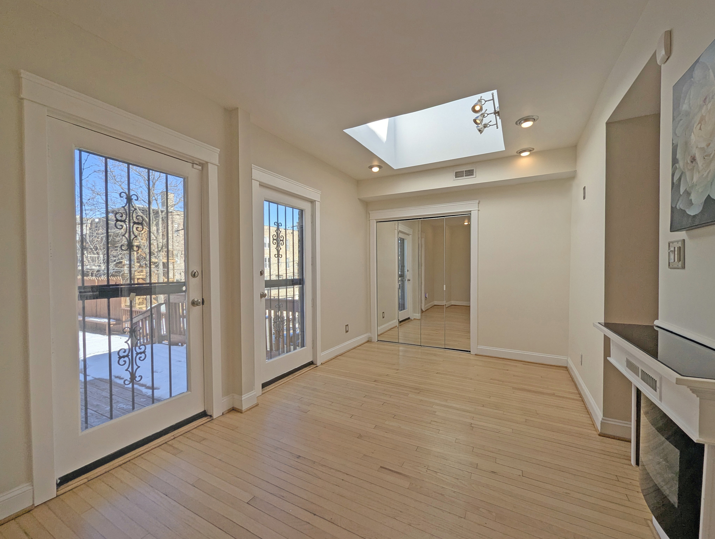 836 East 52nd Street Chicago, IL 60615 - Photo 36 of 43 a view of an empty room with wooden floor and a window