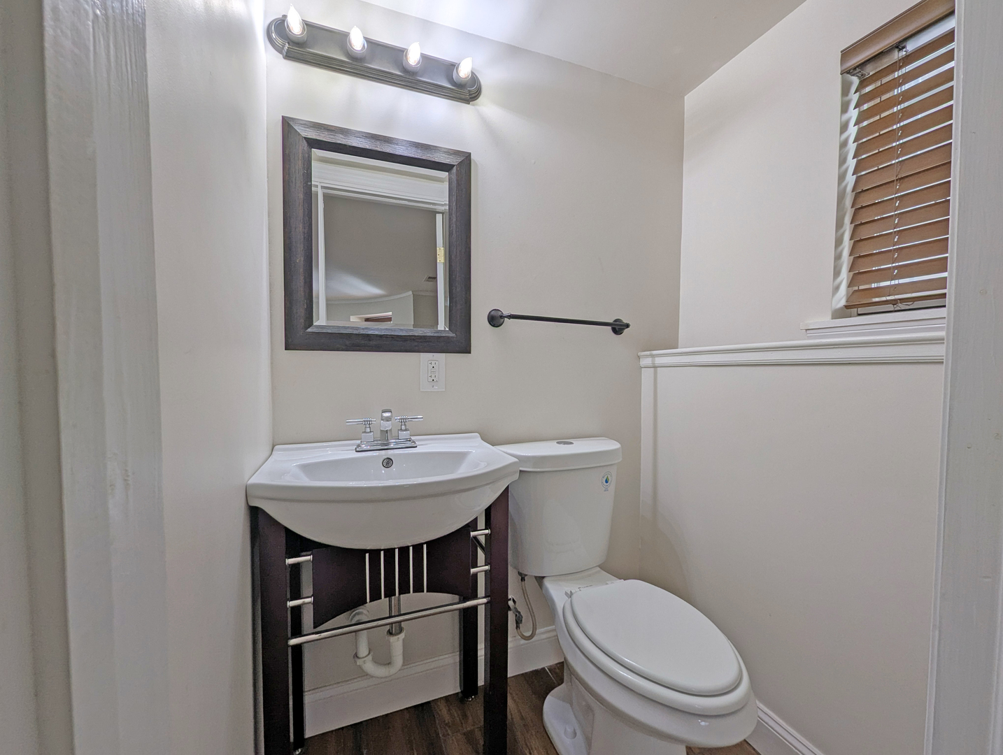836 East 52nd Street Chicago, IL 60615 - Photo 41 of 43 a bathroom with a toilet a sink and a mirror