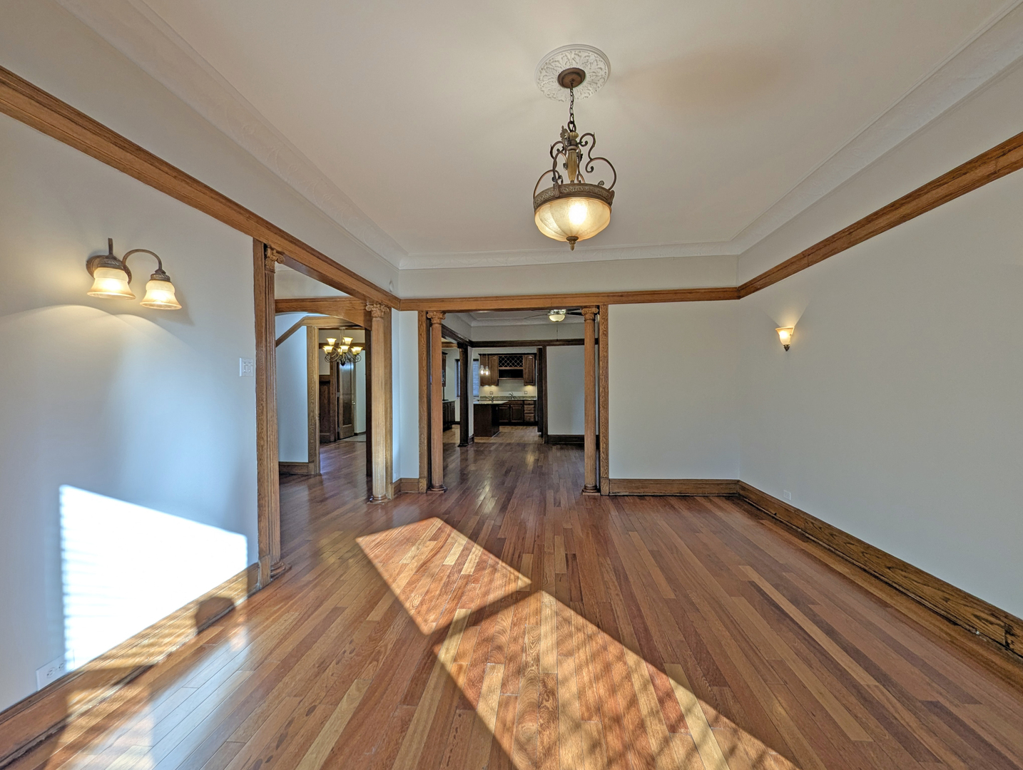 836 East 52nd Street Chicago, IL 60615 - Photo 9 of 43 a view of a room with wooden floor and staircase