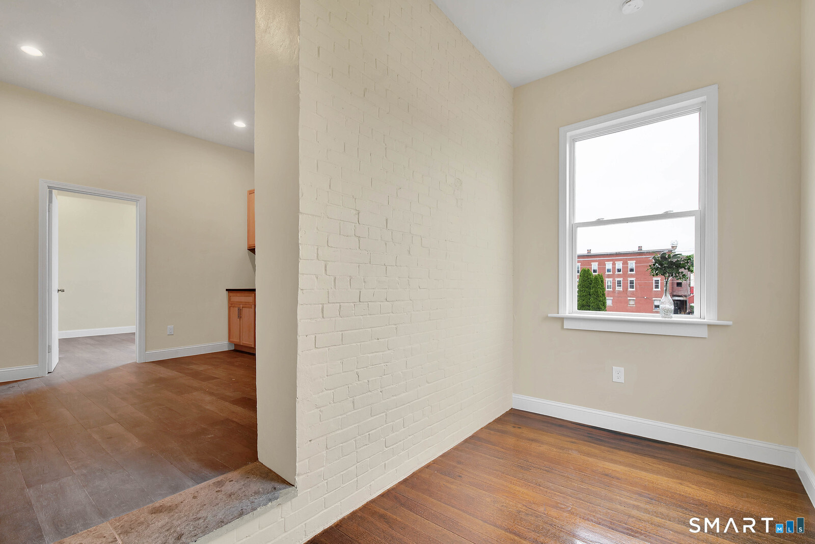 120 East Main Street, Unit 3 Torrington, CT 06790 - Photo 9 of 10 an empty room with wooden floor and a window