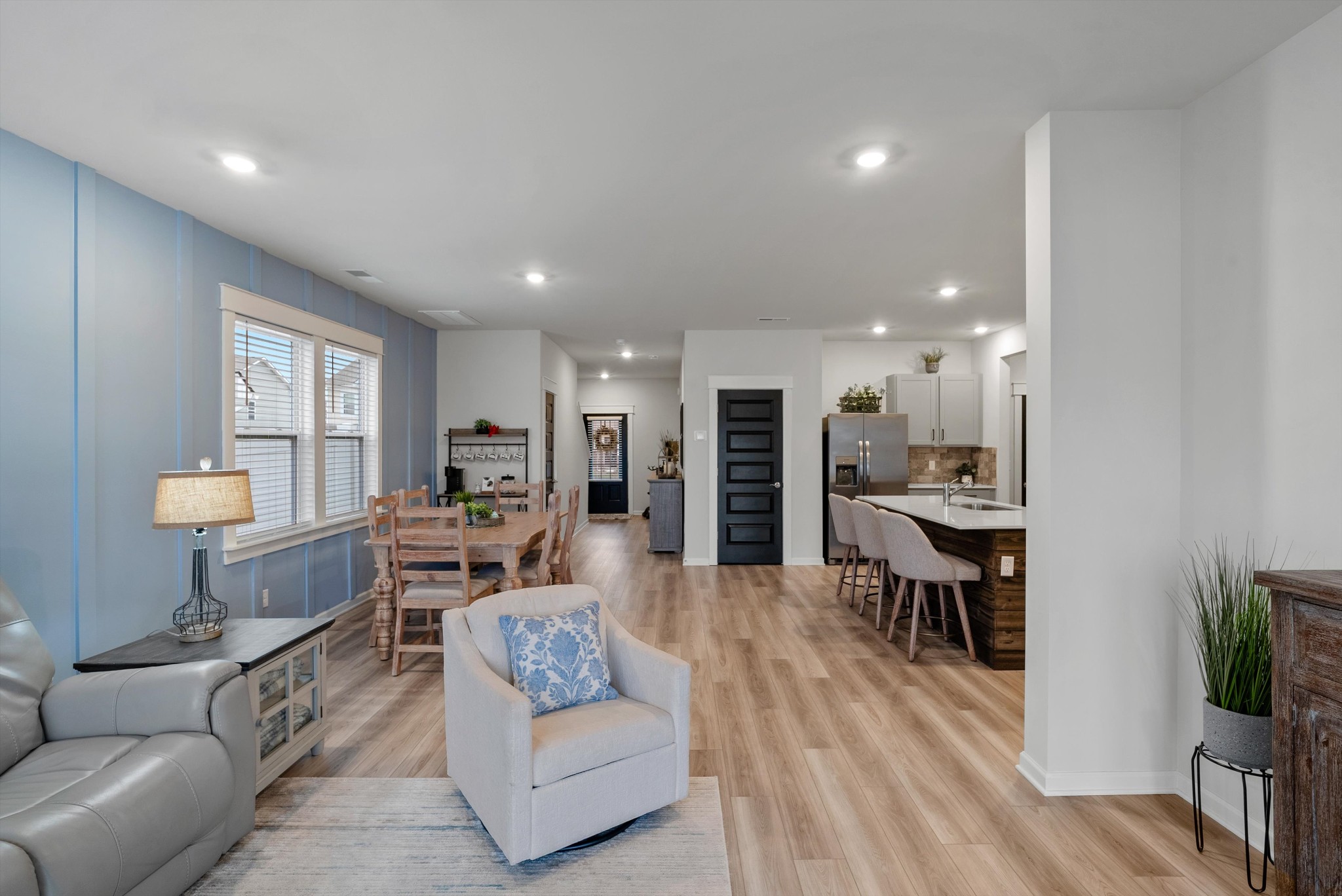 562 Torrey Pines Lane Lebanon, TN 37087 - Photo 11 of 38 a living room with furniture kitchen view and a wooden floor