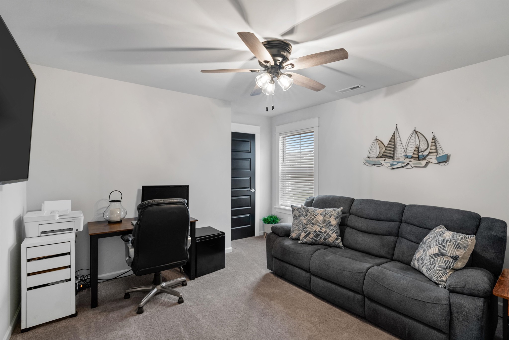 562 Torrey Pines Lane Lebanon, TN 37087 - Photo 27 of 38 a living room with furniture and a flat screen tv