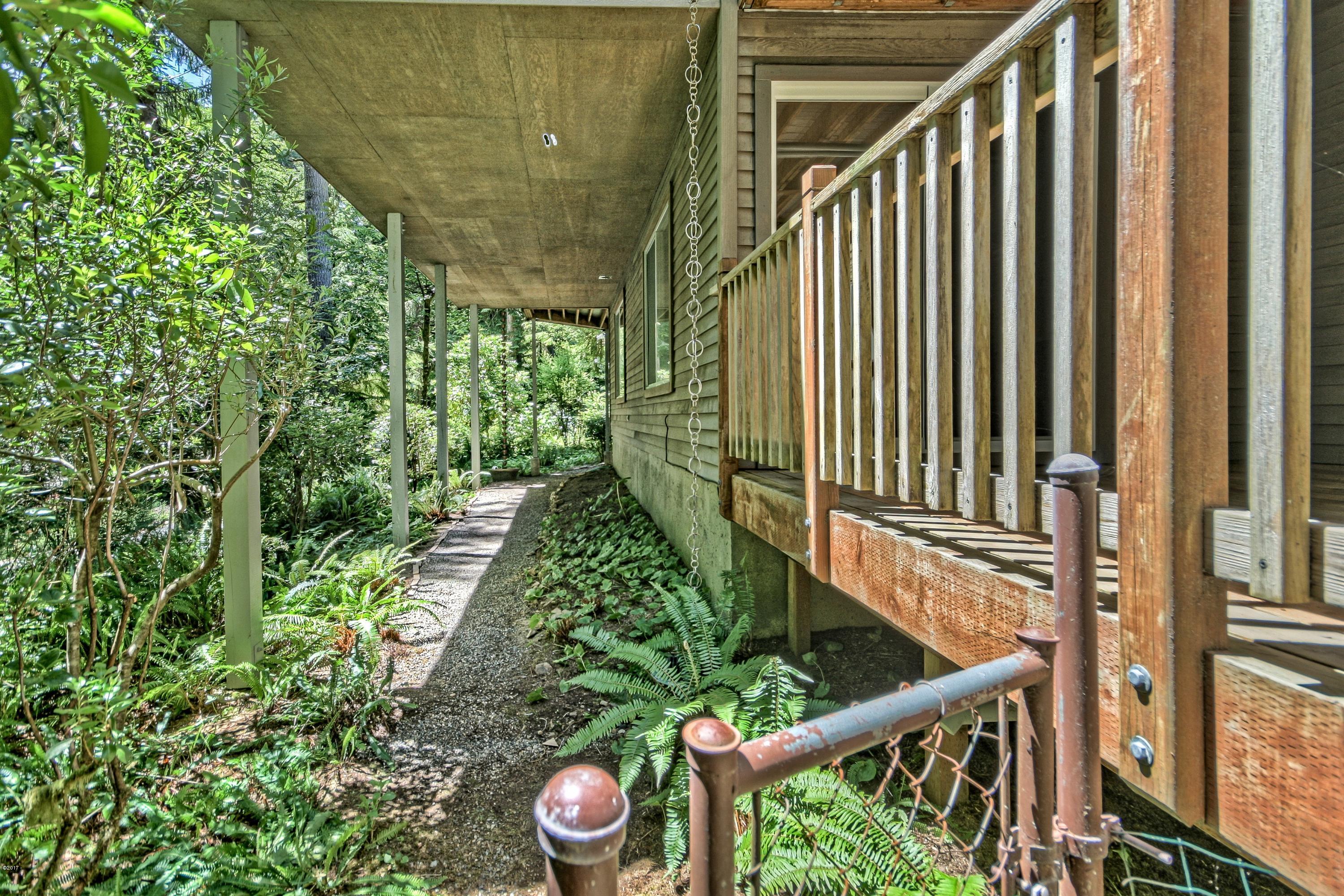 17 Big Tree Road Gleneden Beach, OR 97388 - Photo 34 of 52 a view of a backyard with pathway