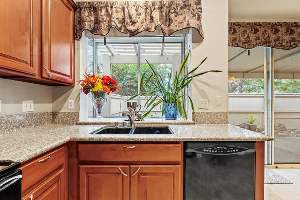 a kitchen with a sink and cabinets