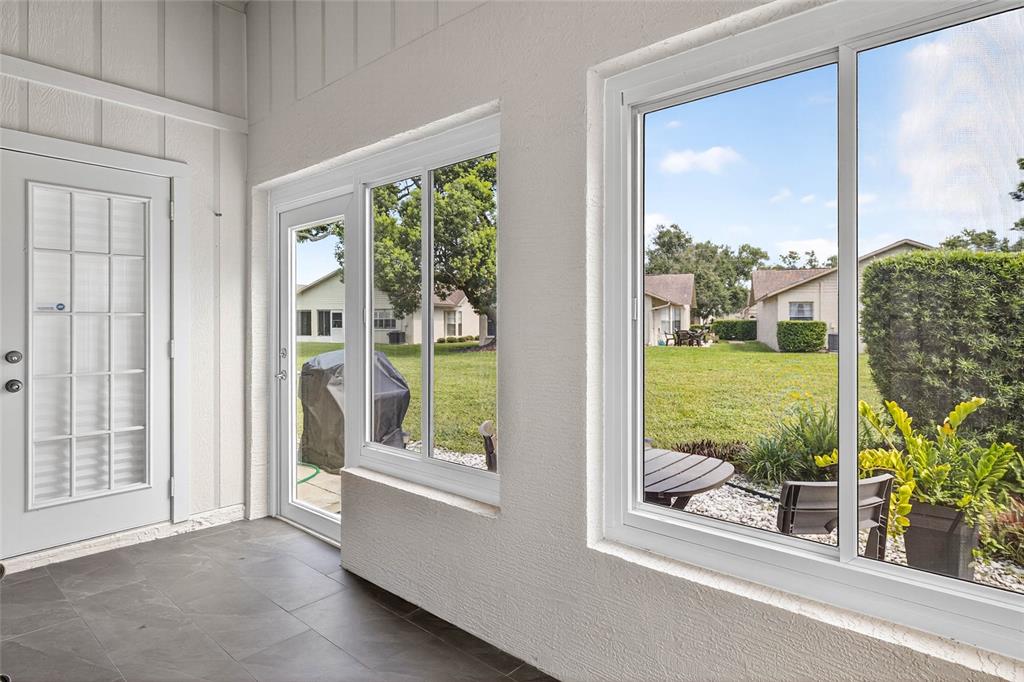 4658 Wallingford Court New Port Richey, FL 34655 - Photo 13 of 48 a view of a room that has a large window and front door