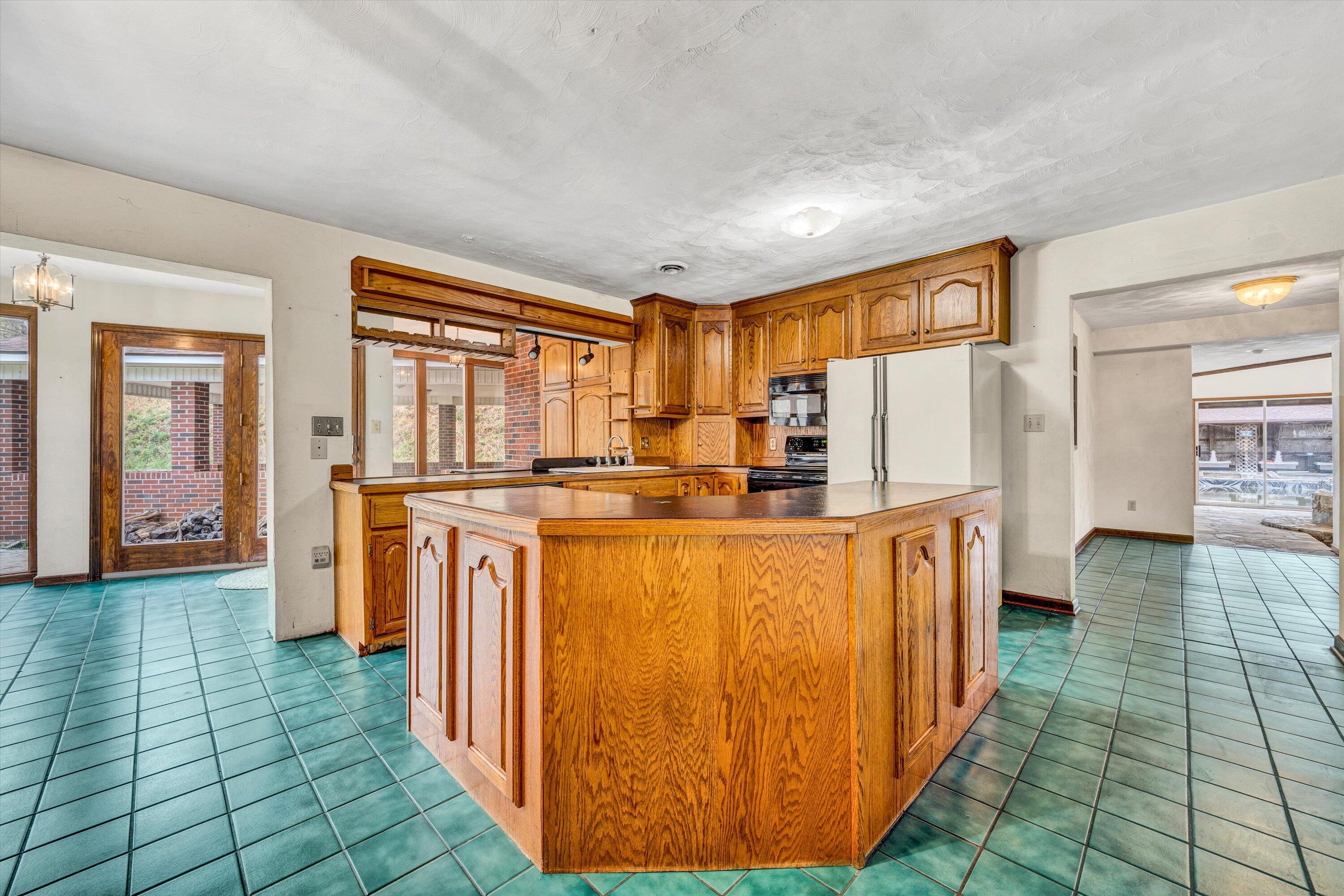1305 Foothills Road Callaway, VA 24067 - Photo 20 of 48 a kitchen with stainless steel appliances a refrigerator and a stove