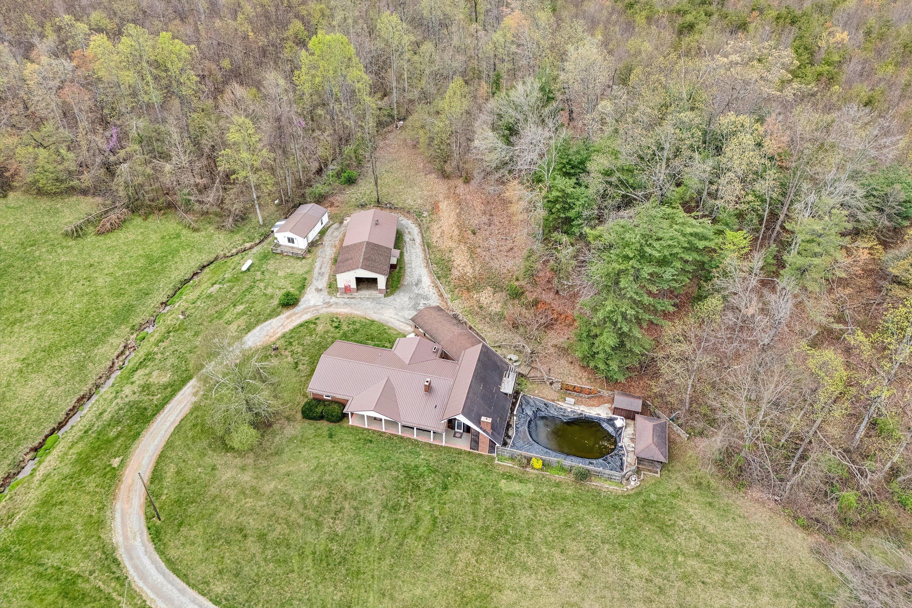 1305 Foothills Road Callaway, VA 24067 - Photo 3 of 48 an aerial view of a house with a yard and trees