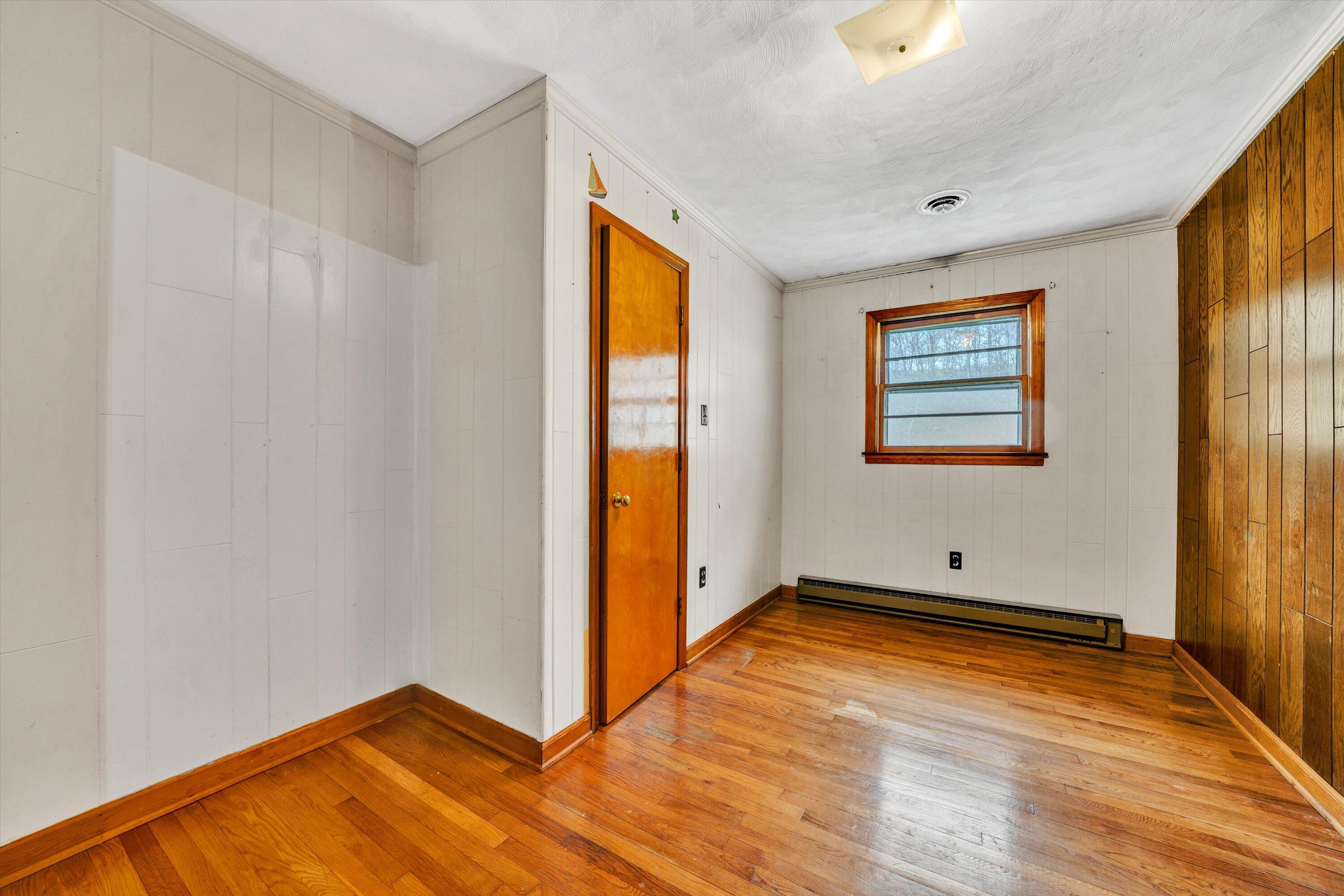 1305 Foothills Road Callaway, VA 24067 - Photo 32 of 48 a view of empty room with wooden floor and fan