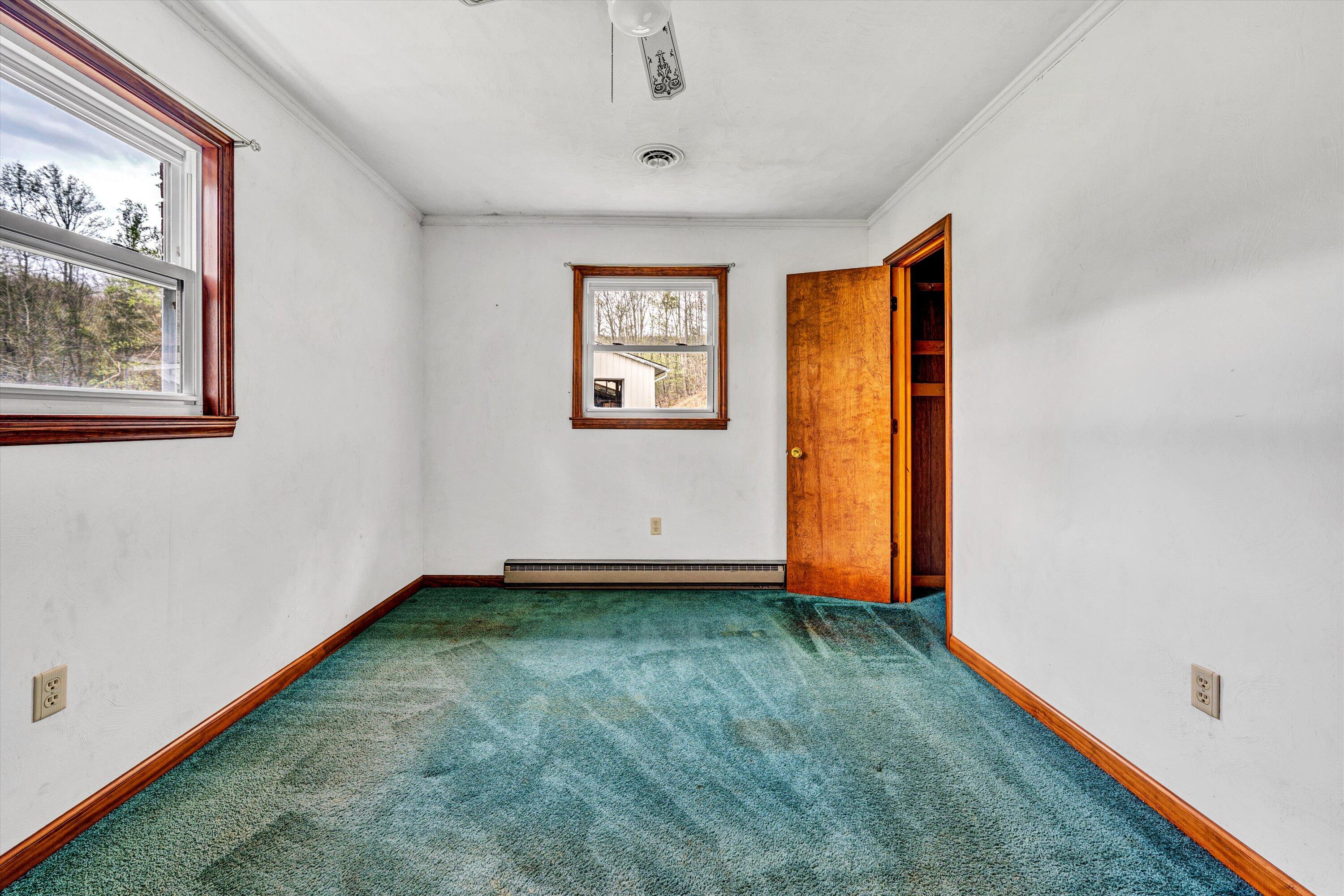 1305 Foothills Road Callaway, VA 24067 - Photo 33 of 48 a view of an empty room with window and wooden floor
