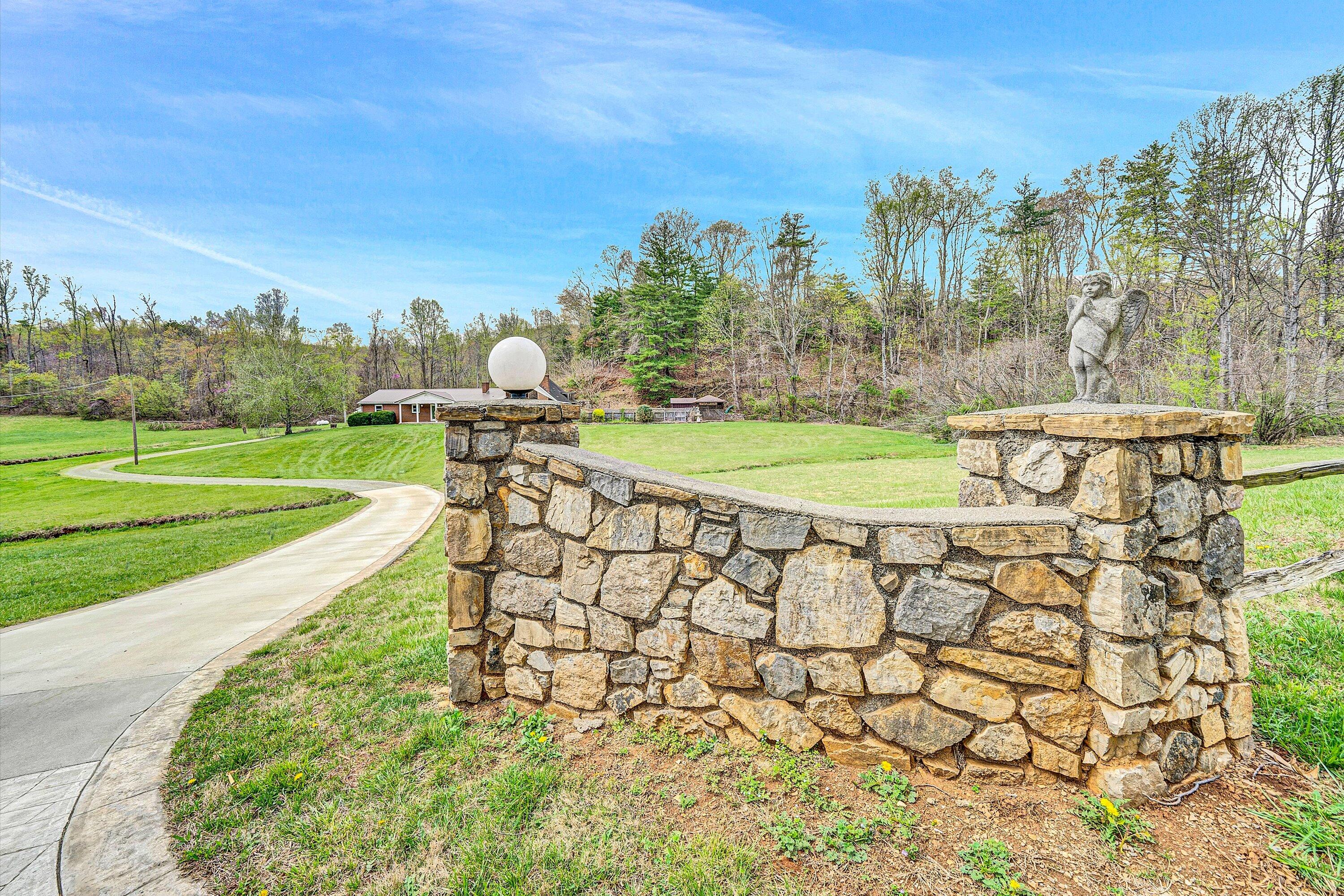 1305 Foothills Road Callaway, VA 24067 - Photo 6 of 48 a view of a swimming pool with a yard and a fountain