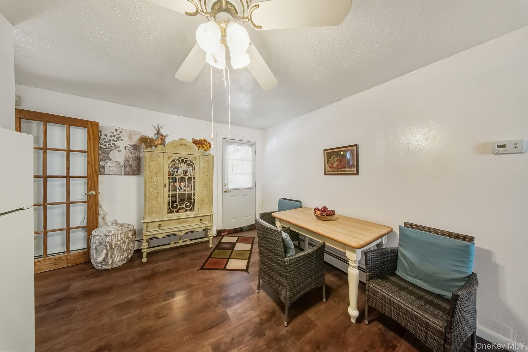41 Birch Road Wurtsboro, NY 12790 - Photo 11 of 25 a living room with furniture a chandelier and a flat screen tv