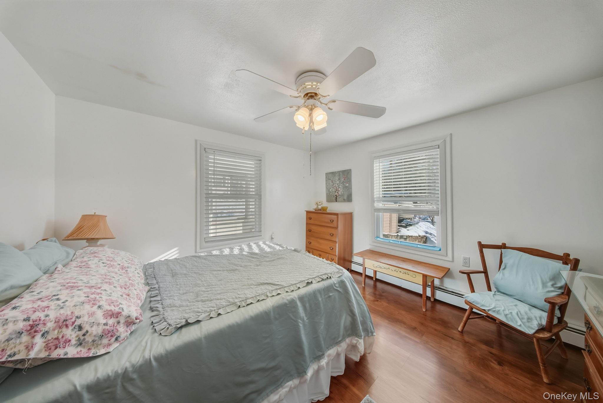 41 Birch Road Wurtsboro, NY 12790 - Photo 12 of 25 a spacious bedroom with a bed a table and chair