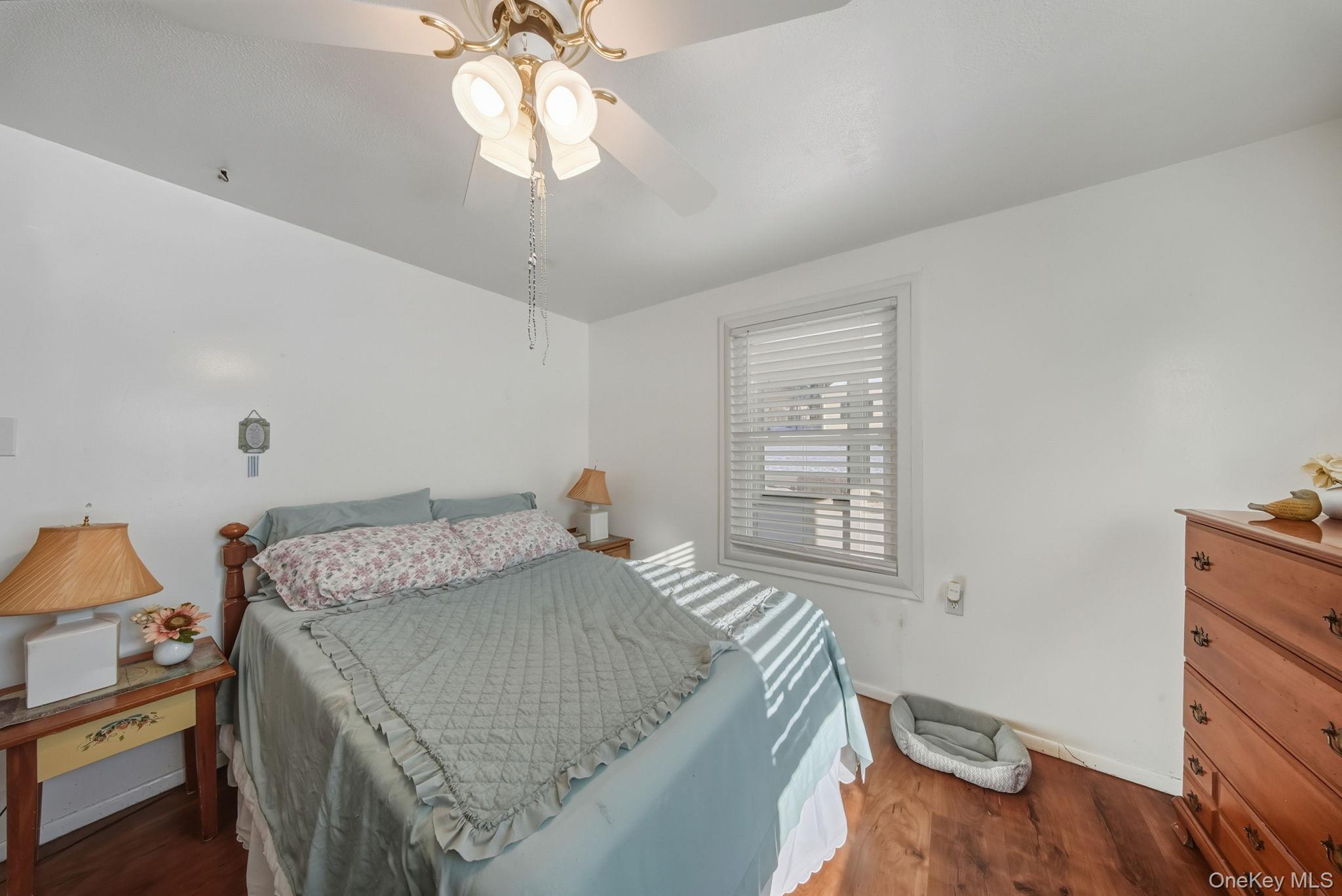 41 Birch Road Wurtsboro, NY 12790 - Photo 13 of 25 a bedroom with a bed and a window