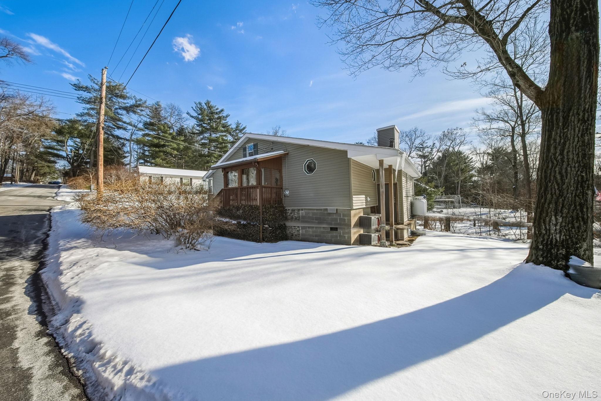 41 Birch Road Wurtsboro, NY 12790 - Photo 24 of 25 a view of a house with snow on the background