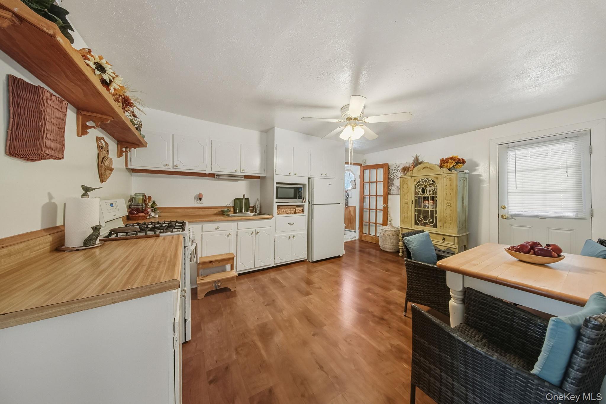 41 Birch Road Wurtsboro, NY 12790 - Photo 8 of 25 a kitchen with a stove a sink and a refrigerator