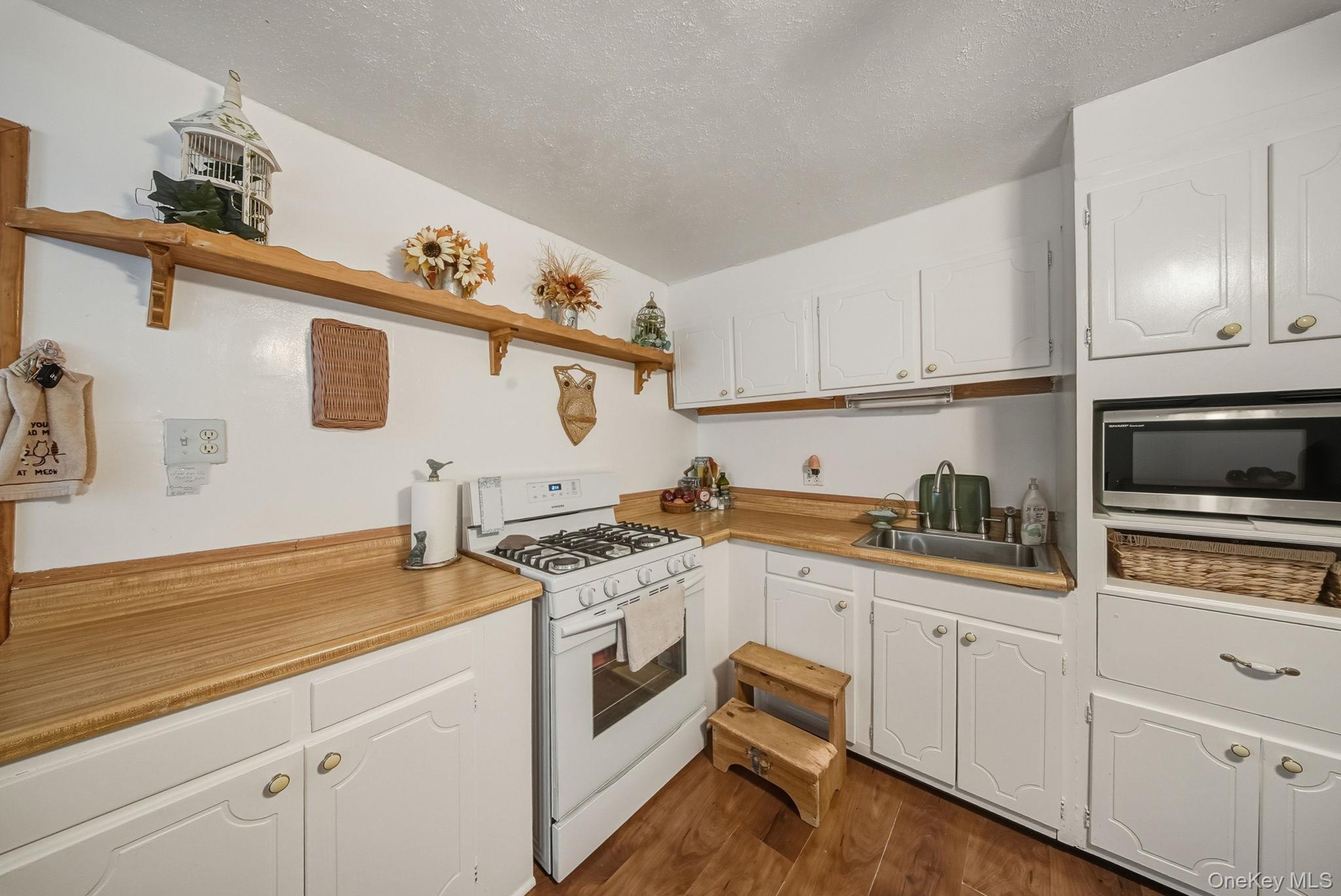 41 Birch Road Wurtsboro, NY 12790 - Photo 10 of 25 a kitchen with stainless steel appliances granite countertop a sink and cabinets