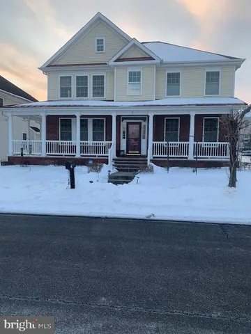 a front view of a house with yard