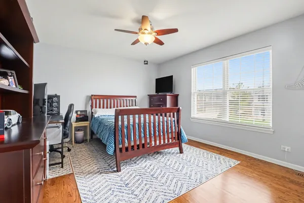 a bedroom with furniture and a window