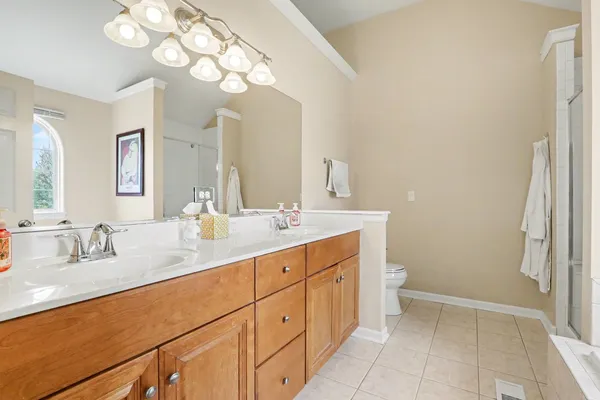 a bathroom with a sink a vanity and a mirror