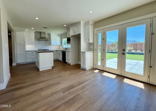 a view of kitchen with wooden floor