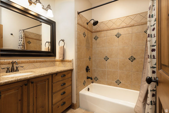 382 Ridgeview Street, Unit 8 & 9 Brian Head, UT 84719 - Photo 42 of 52 Bathroom featuring a built-in vanity with wood cabinetry, a granite countertop, and an integrated sink
