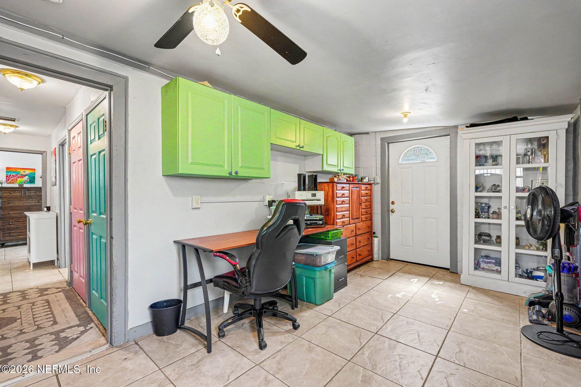 3500 Roosevelt Road Mims, FL 32754 - Photo 20 of 30 a view of a workspace with furniture and a window